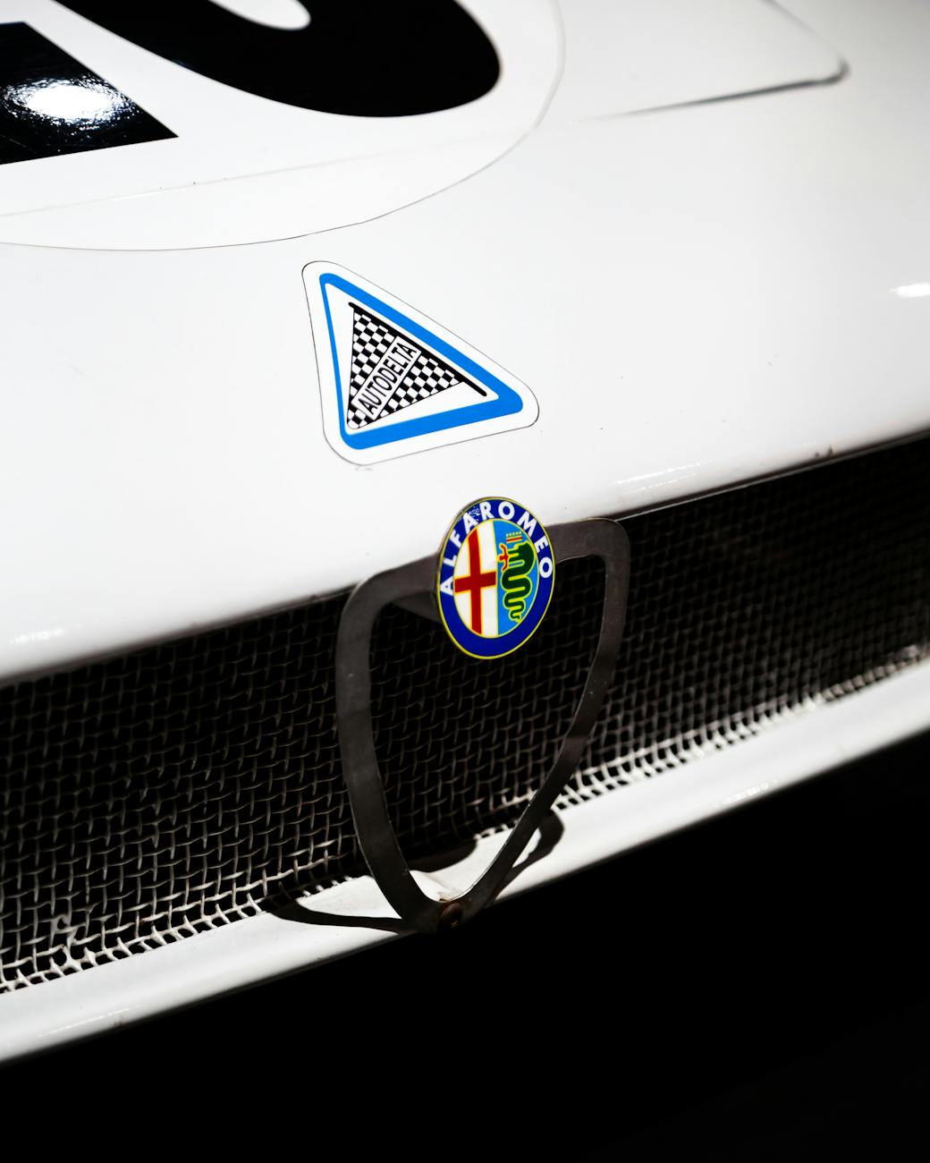 alfa romeo classic car emblem on display